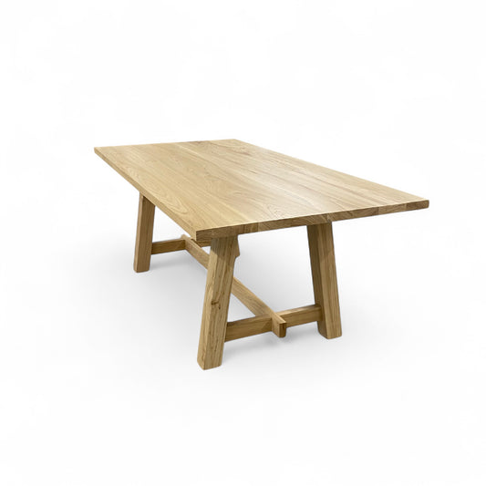 Wooden dining table on a white background