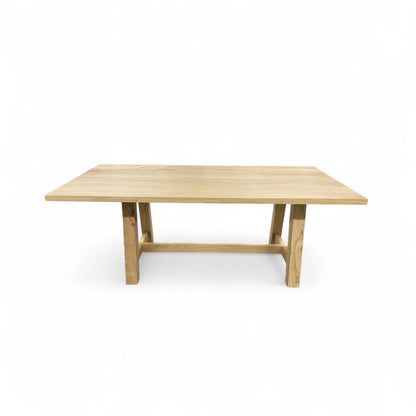 Wooden dining table on a white background
