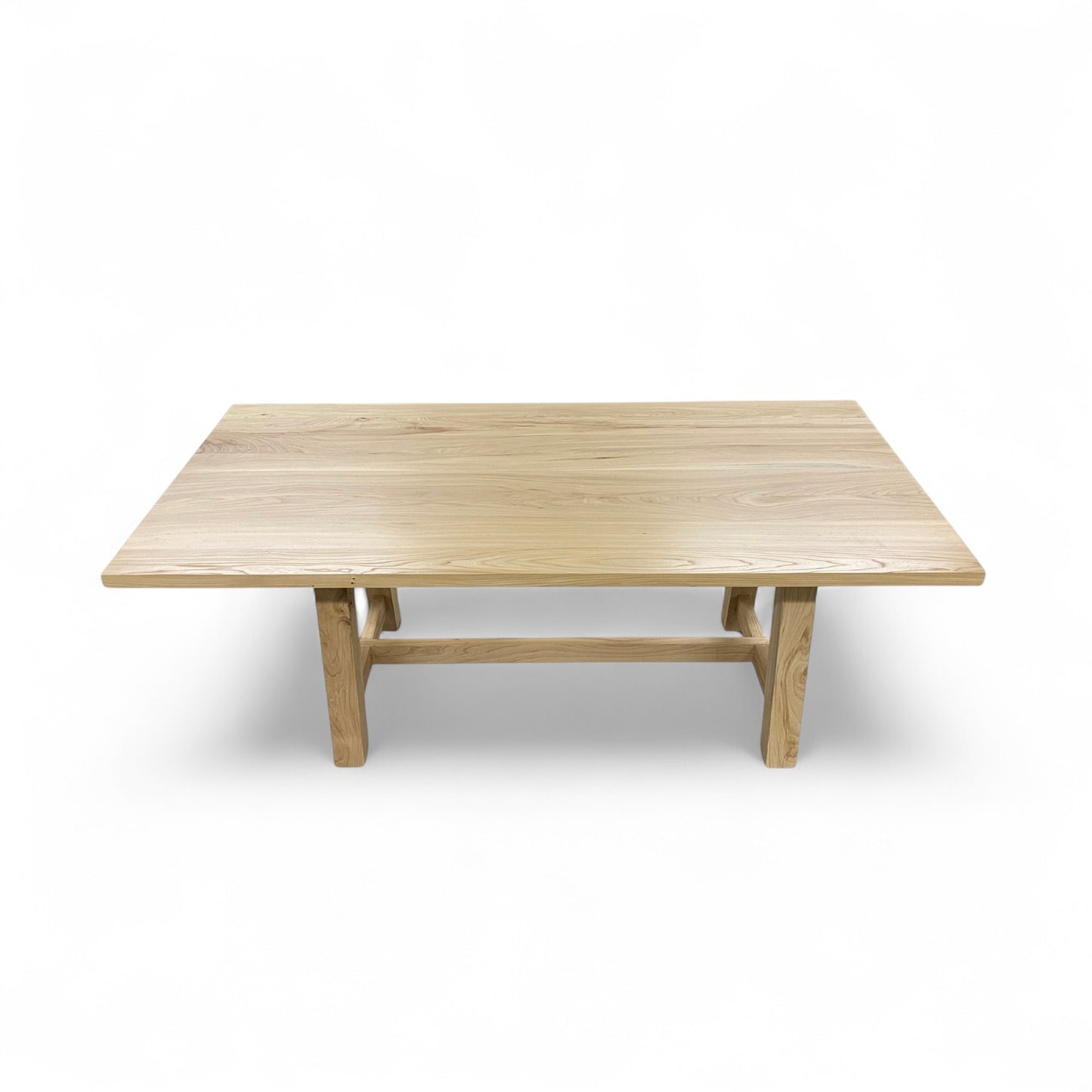 Wooden dining table on a white background