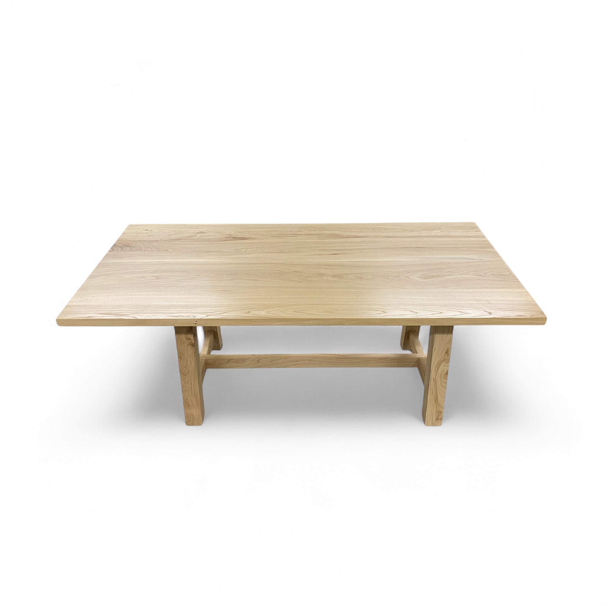 Wooden dining table on a white background