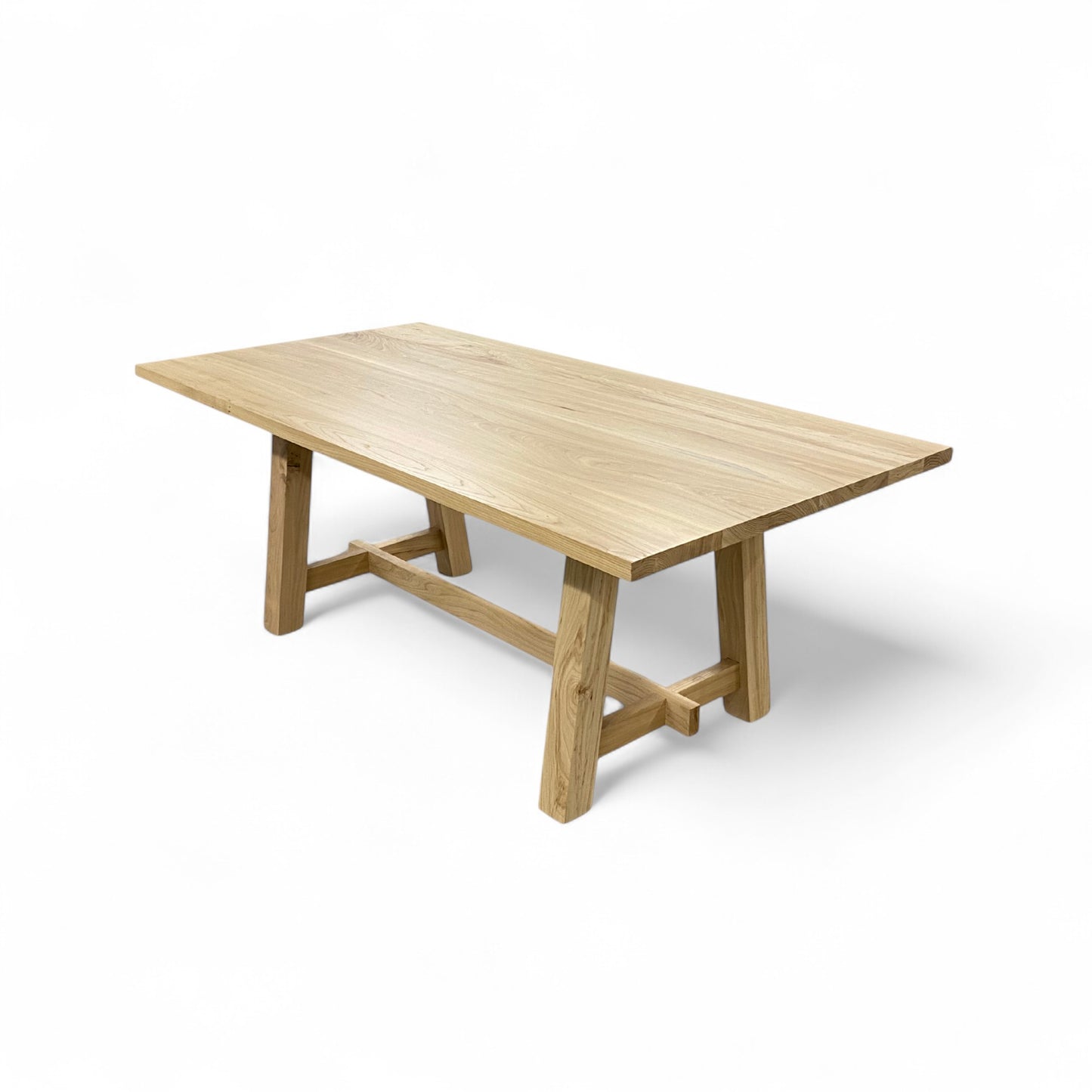 Wooden dining table on a white background