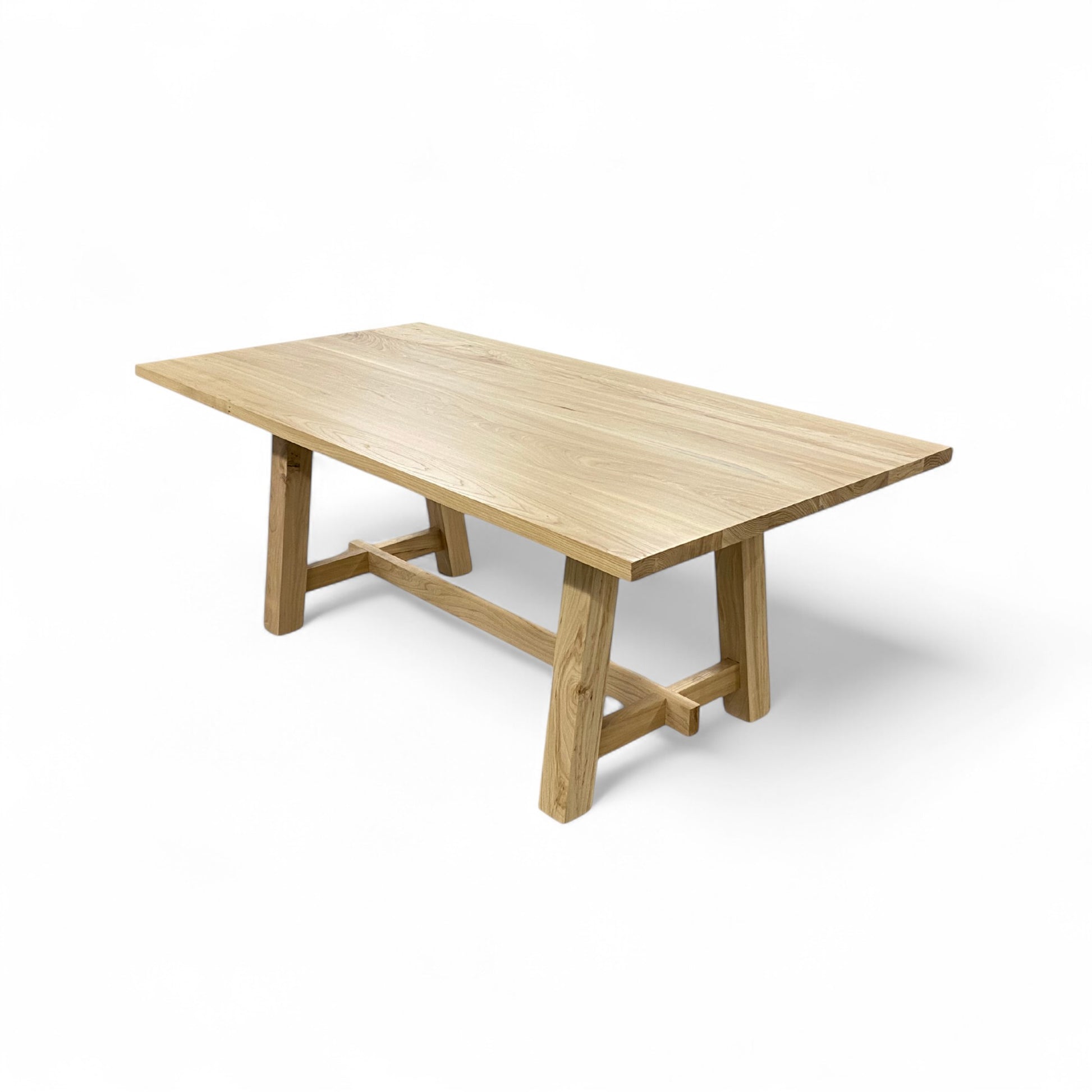 Wooden dining table on a white background
