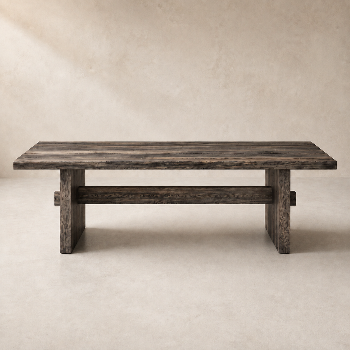 A rustic dark wood dining table with a thick rectangular top and block legs, shown against a neutral textured beige background.