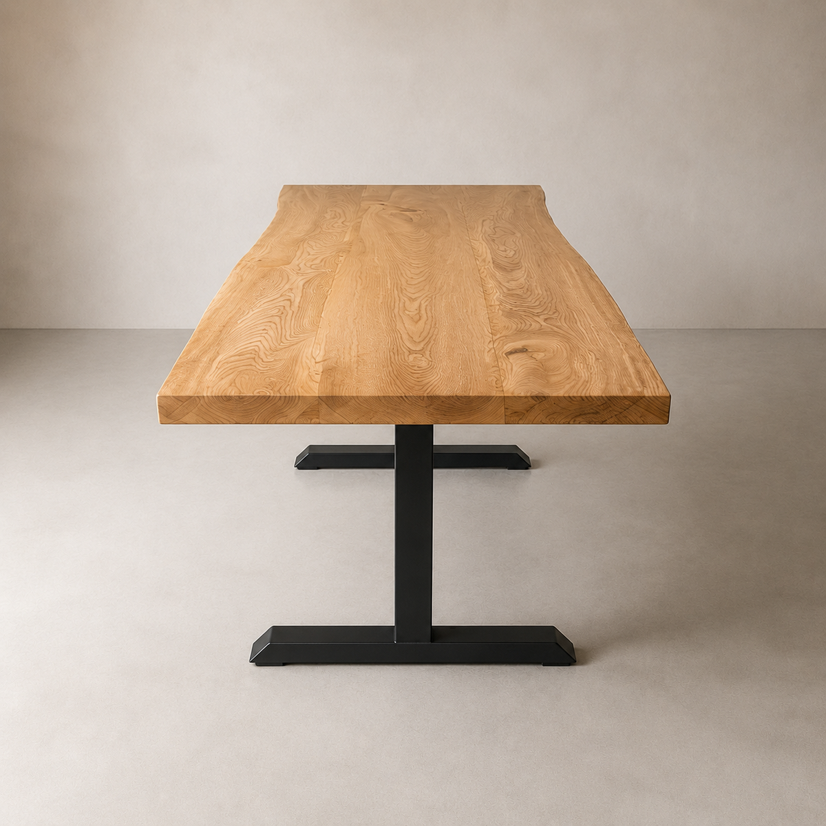 A live-edge wooden dining table with a natural elm top and a black metal pedestal base, photographed in a minimalist studio setting.