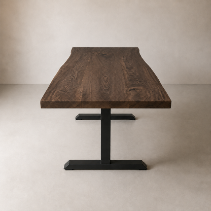 A live-edge wooden dining table with a dark brown wood grain top and a black metal T-style pedestal base, photographed in a minimalist studio setting with a warm beige background.