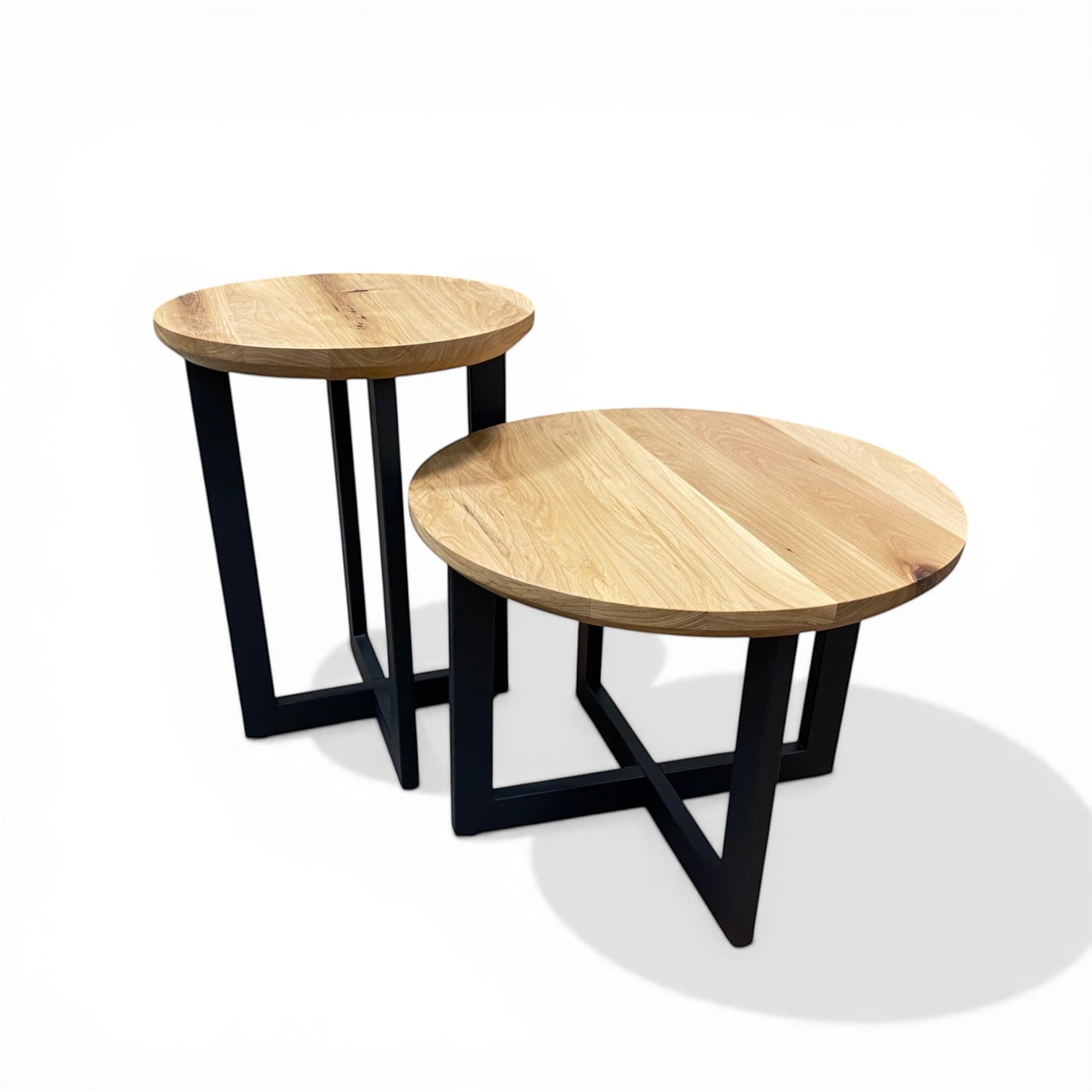 Urban Lumber classic nesting accent tables made from reclaimed solid wood with black metal bases. Round tops.
