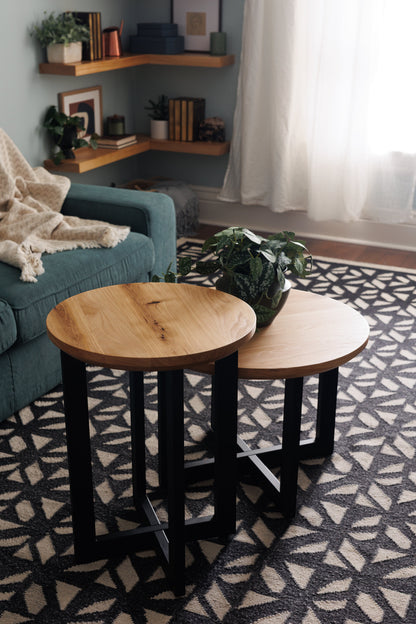 Urban Lumber Classic Nesting Accent Tables, round natural wood tops with black metal bases, set of two.