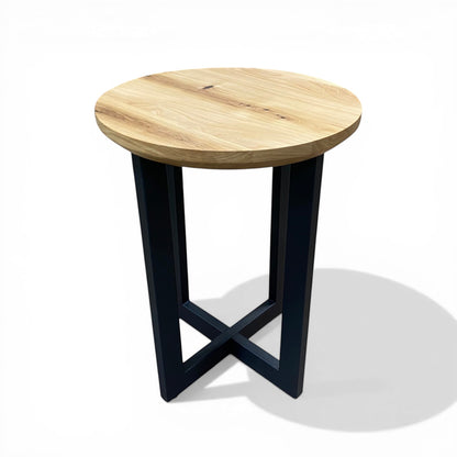 Urban Lumber classic round side table with natural elm wood top and black steel base with cross detail.