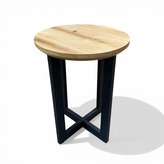 Urban Lumber classic round side table with natural elm wood top and black steel base with cross detail.
