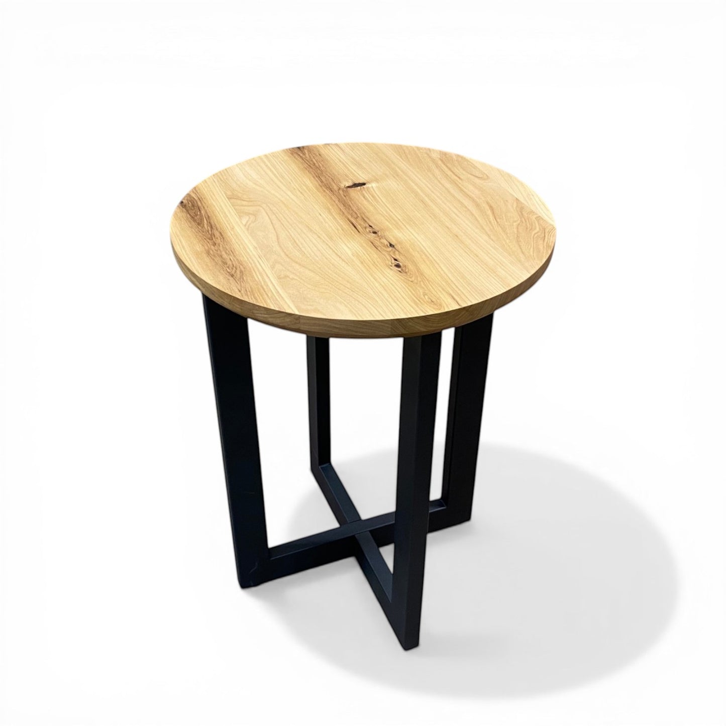 Urban Lumber classic round side table with natural wood top and black steel base.